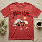 California Kingsnake Feral T-Shirt in Heather Red — Banded California kingsnake coiled with a tiny companion snake under a jagged blood-red metal wordmark and pastel scene.