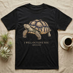 Sulcata Outlive You T-Shirt in Black — Ukiyo-e woodblock illustration of a sulcata tortoise in profile with a deadpan serif caption about outliving you.