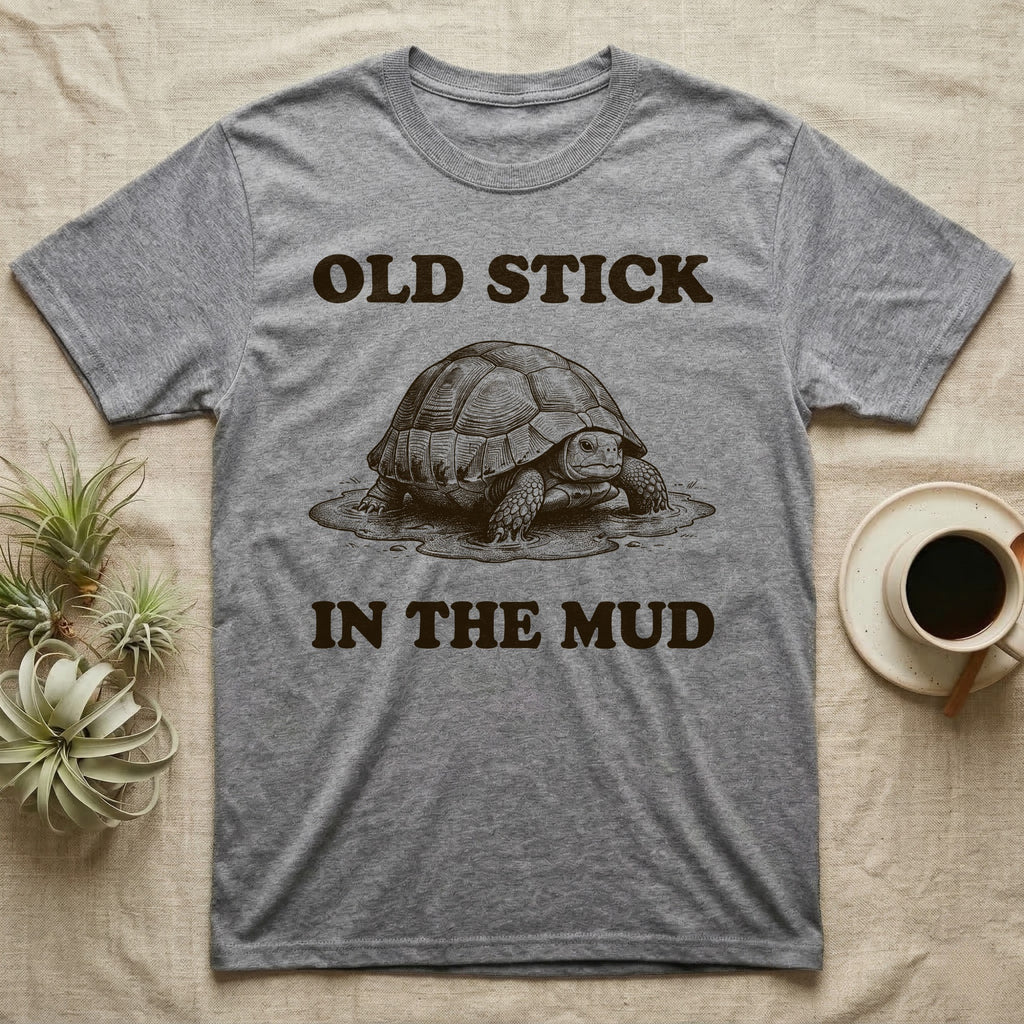 Hermann's Tortoise Mud T-Shirt in Sport Grey — Engraved Hermann's tortoise sitting in a mud puddle, with the words Old Stick in the Mud