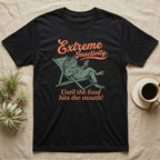 Pacman Frog Lazy Day T-Shirt in Black — Illustrated pacman frog reclining in a beach chair in a jacket with sunglasses and a cocktail, coral script reading Extreme Inactivity Until The Food Hits The Mouth.