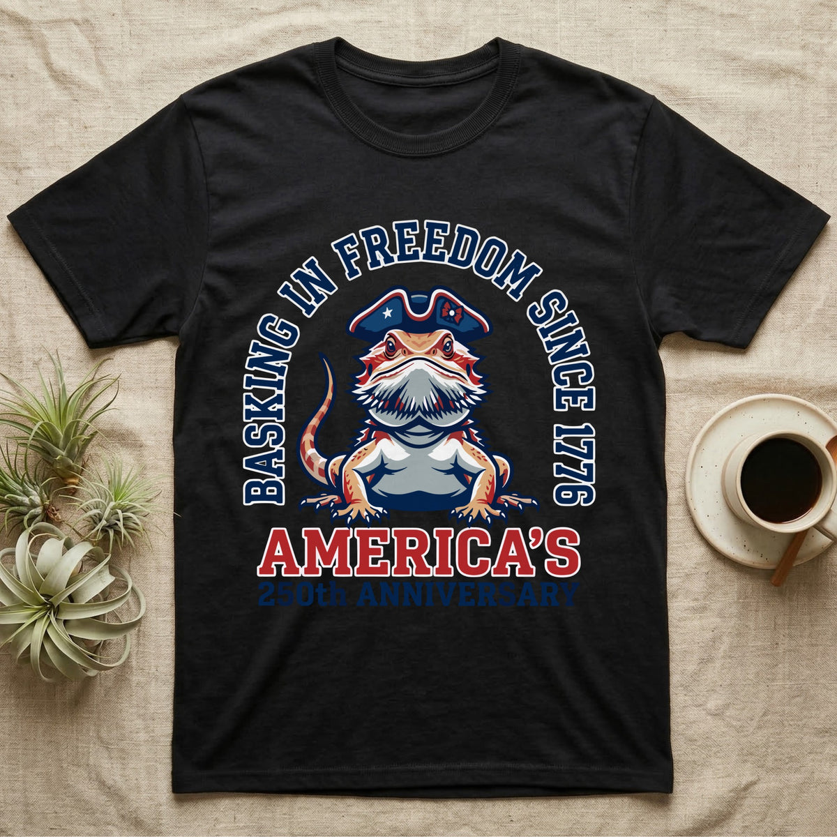 Bearded Dragon Basking T-Shirt in Black — Sports-logo bearded dragon in a tricorn hat under a collegiate arch reading Basking in Freedom Since 1776.