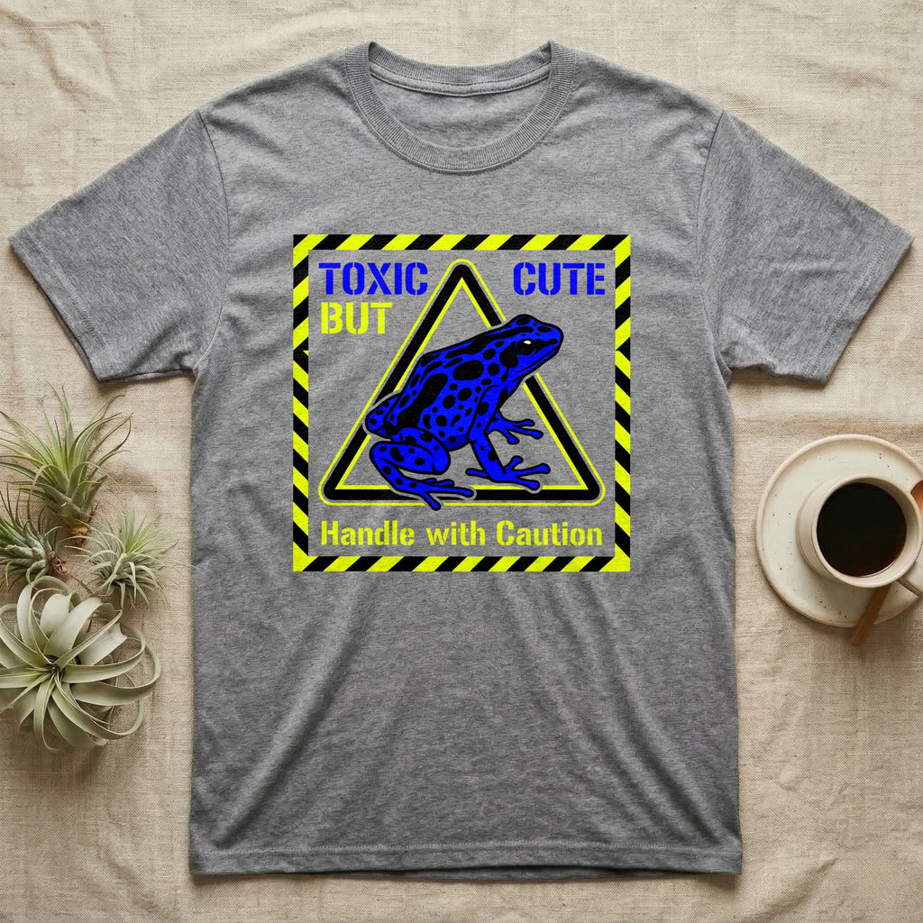 Gray t-shirt with "Toxic But Cute" and blue frog on warning sign.