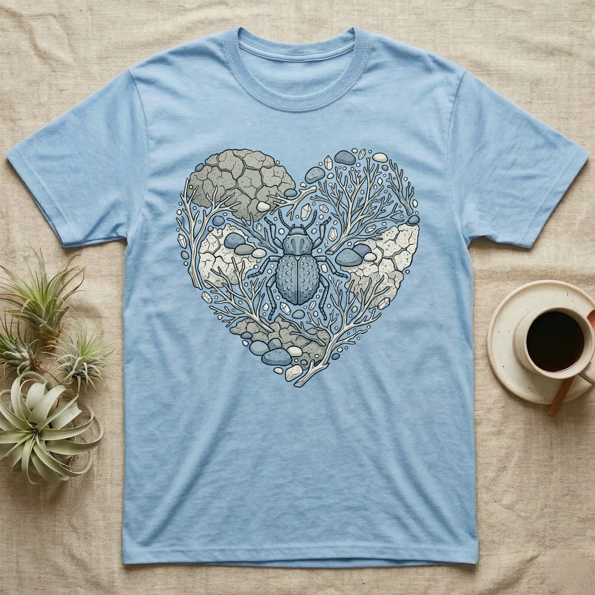 Light blue t-shirt with a heart-shaped nature design featuring a beetle.