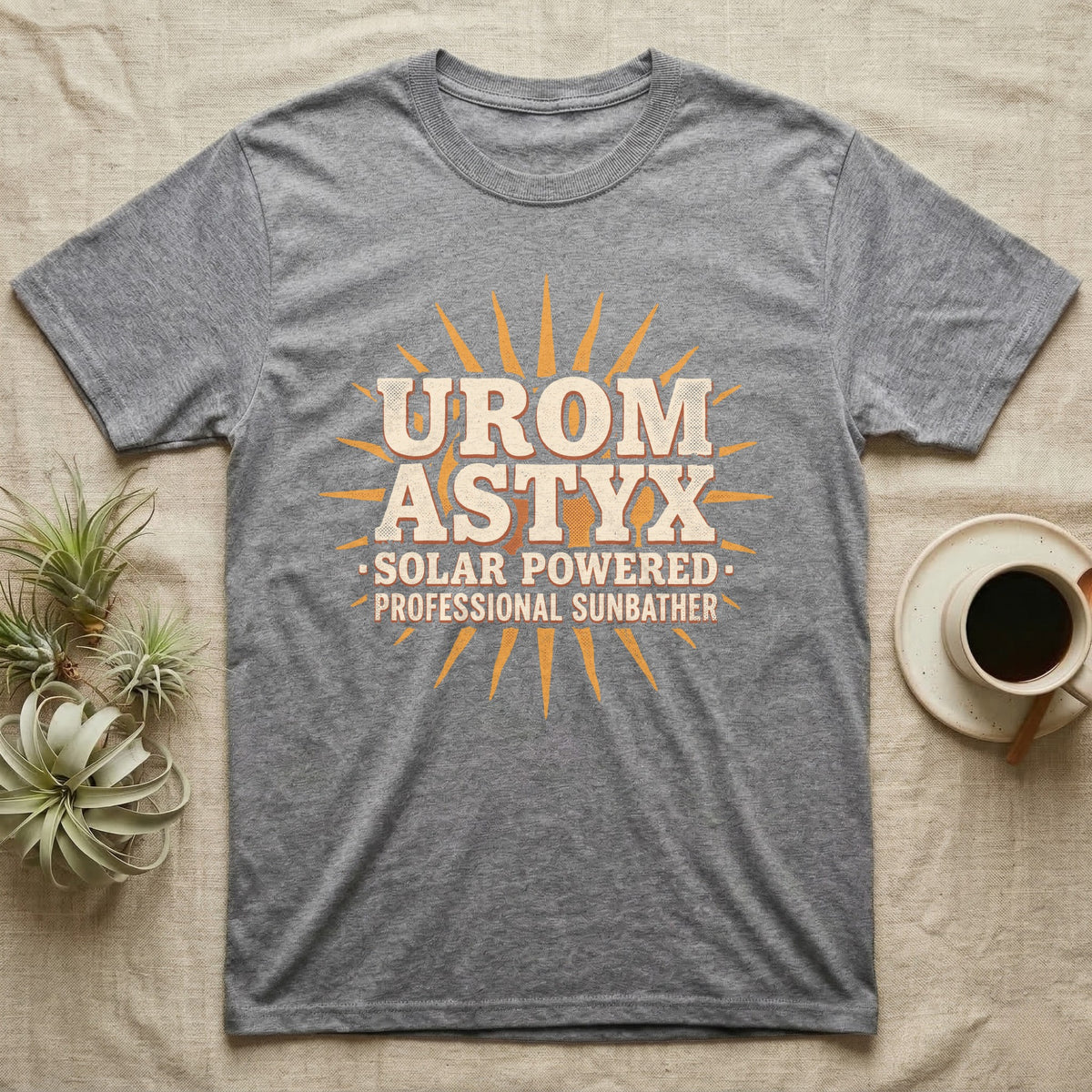 Solar Powered Uromastyx T-Shirt in Sport Grey — Desert-poster wordmark reading "Uromastyx Solar Powered Professional Sunbather" with a small radiating sun motif.