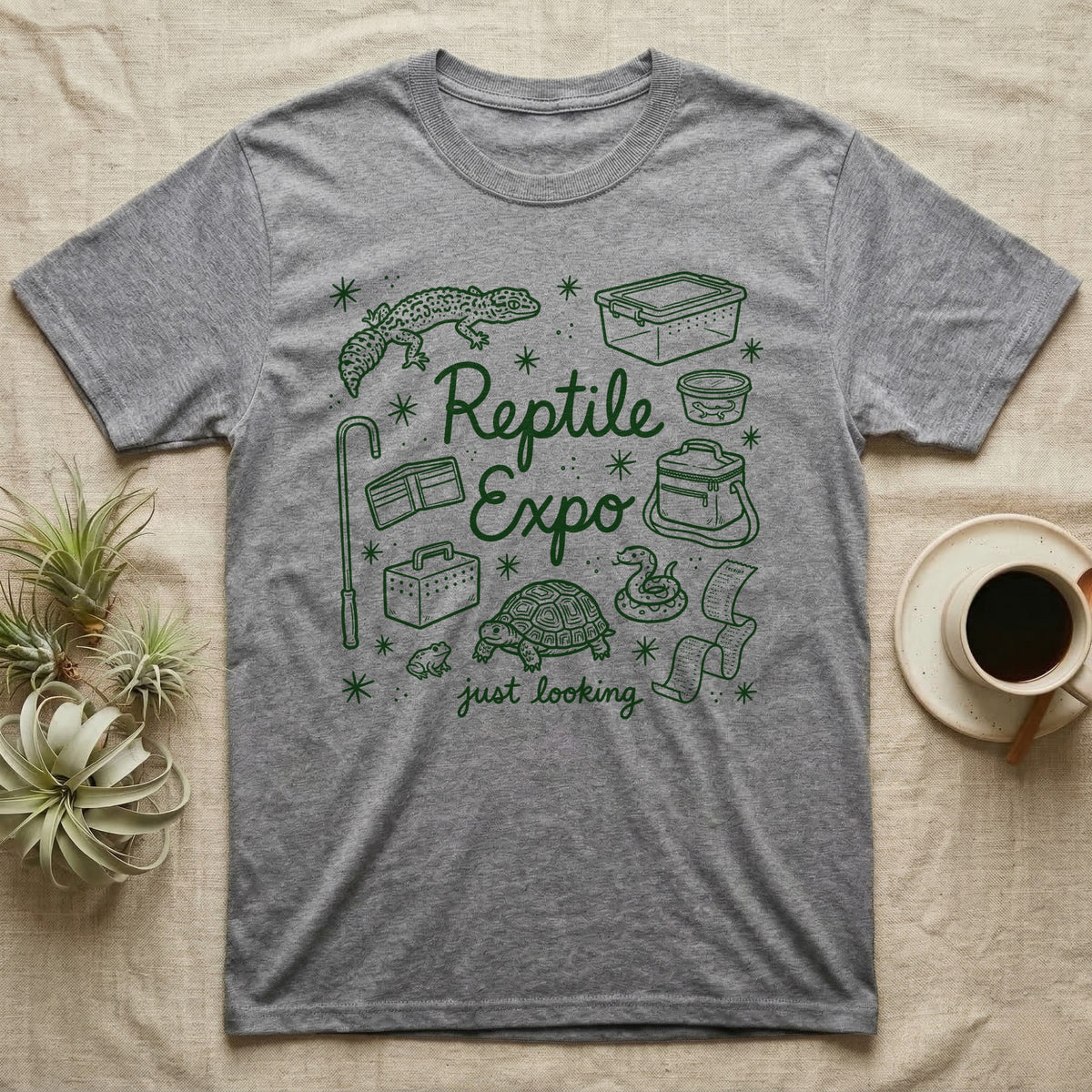 Reptile Expo T-Shirt in Sport Grey — Green marker cursive reading Reptile Expo just looking, ringed by doodles of deli cups, tubs, a gecko and a tortoise