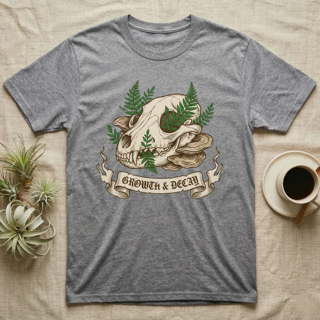 Grey t-shirt featuring a skull, mushrooms, and ferns with "Growth & Decay" banner.