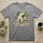 Grey t-shirt featuring a skull, mushrooms, and ferns with "Growth & Decay" banner.