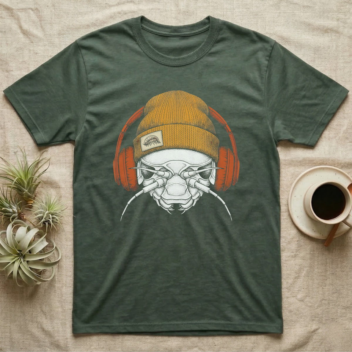 Isopod Heavy Beats T-Shirt in Military Green — Engraved isopod with detailed chitin plating and antennae, wearing a knit beanie and over-ear headphones.