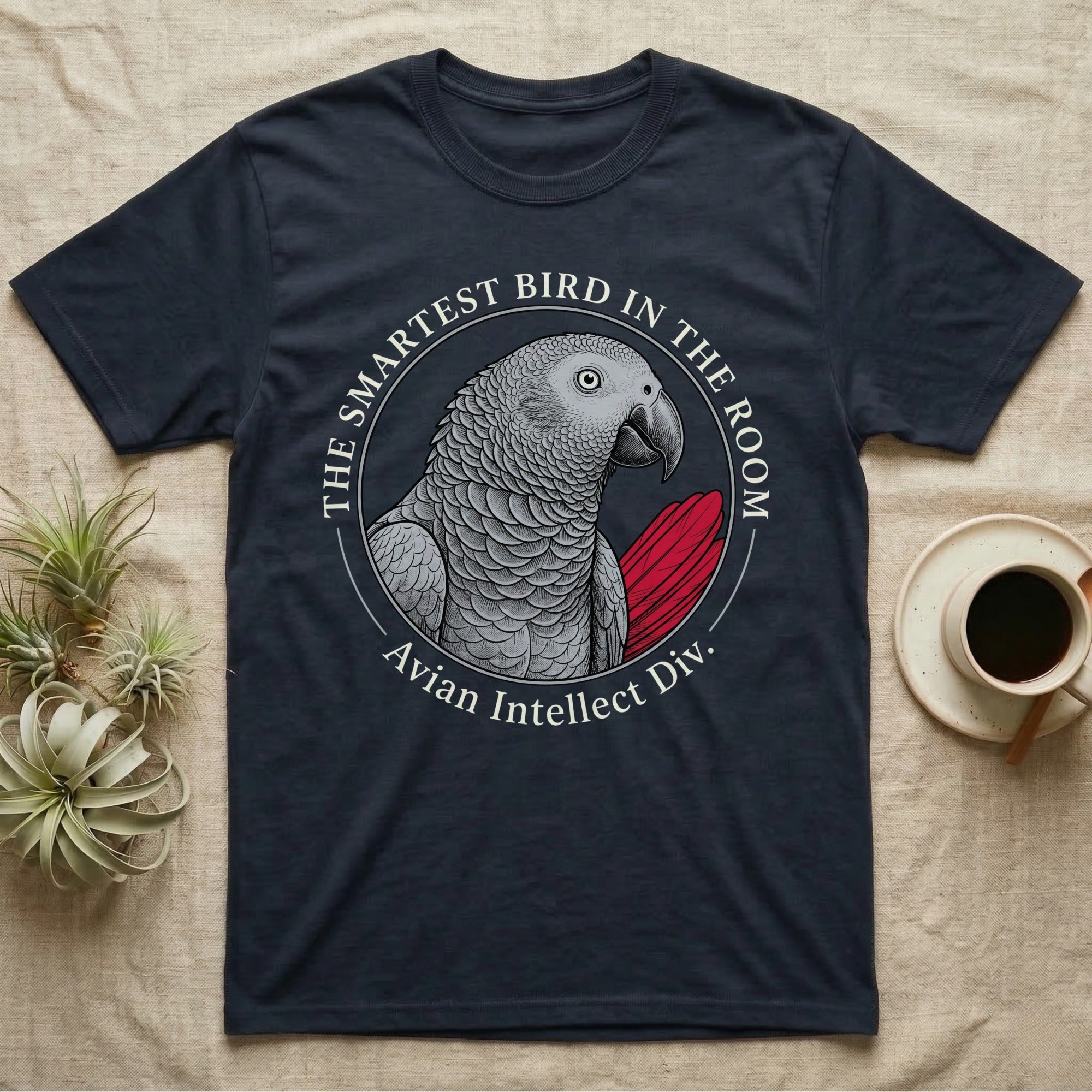 Dark t-shirt with a grey parrot and "The Smartest Bird in the Room" text.