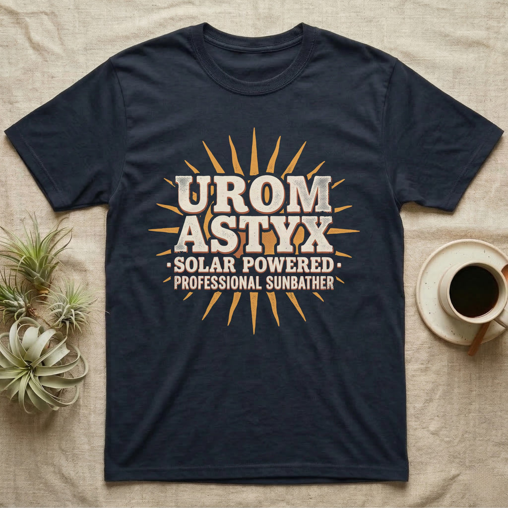 Solar Powered Uromastyx T-Shirt in Navy — Desert-poster wordmark reading "Uromastyx Solar Powered Professional Sunbather" with a small radiating sun motif.