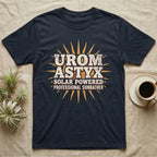 Solar Powered Uromastyx T-Shirt in Navy — Desert-poster wordmark reading "Uromastyx Solar Powered Professional Sunbather" with a small radiating sun motif.