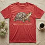 Box Turtle Wiggle T-Shirt in Heather Red — Retro-illustration of a box turtle mid shell-scratch with a hand-drawn arrow at its wiggling rear and a deadpan marker caption.