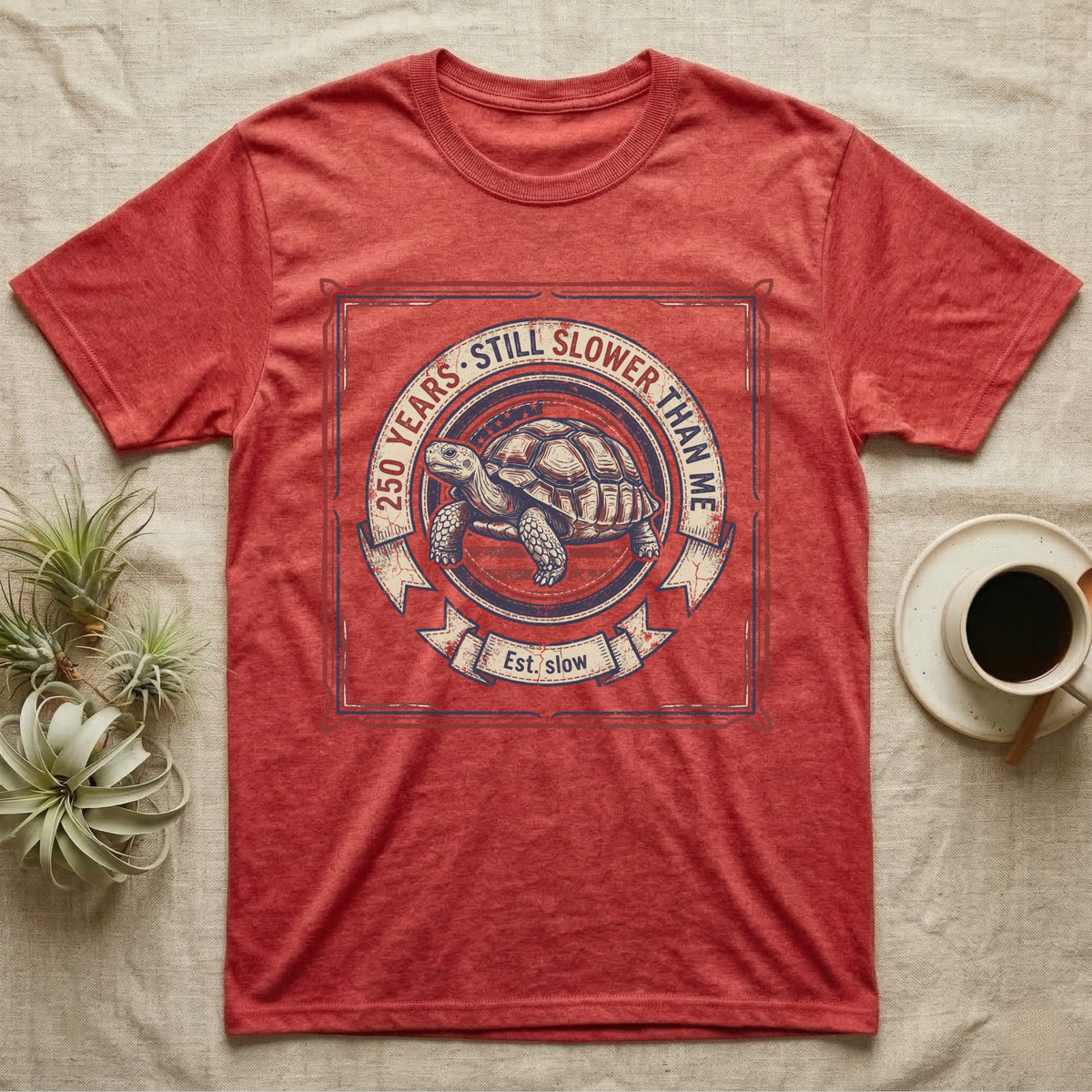 Slower Than Me Tortoise T-Shirt in Heather Red — Vintage-Americana roundel illustration of a tortoise with a banner reading "250 Years, Still Slower Than Me."
