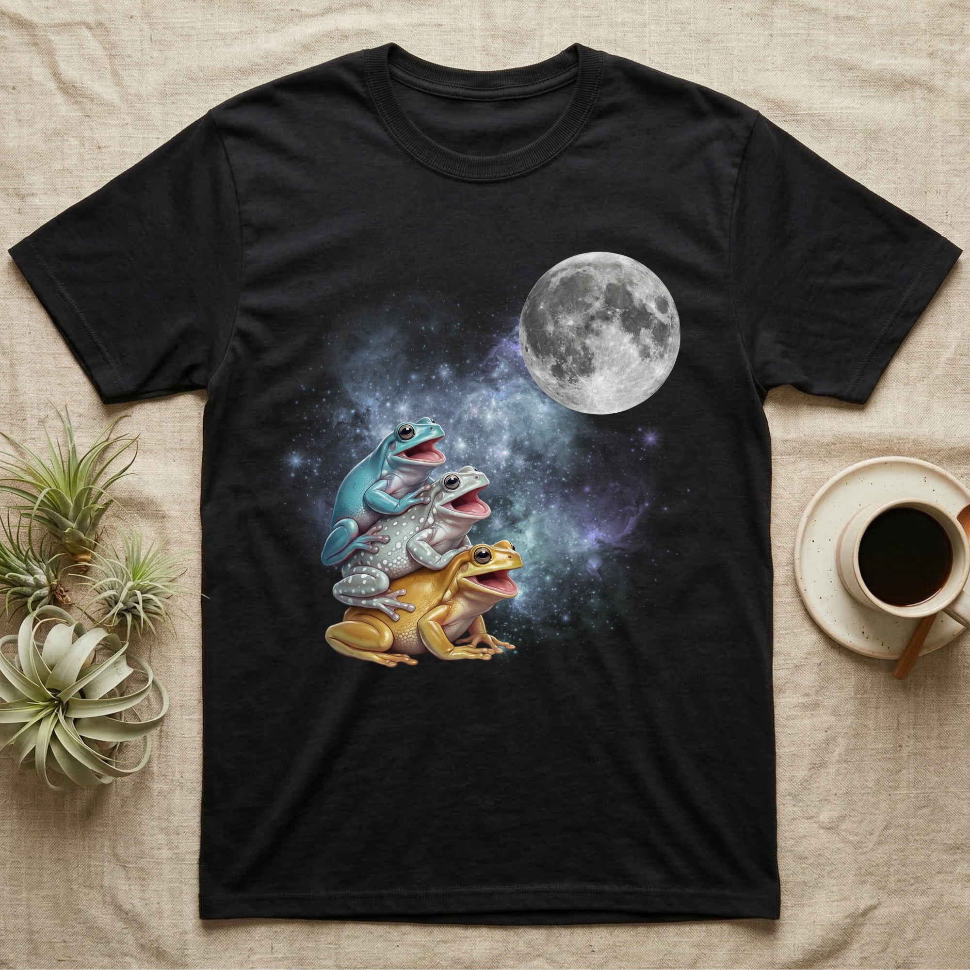 White's Tree Frog Moon Howl T-Shirt in Black — Three White's Tree Frog colour morphs howling at a full moon over a nebula on a dark grey t-shirt.