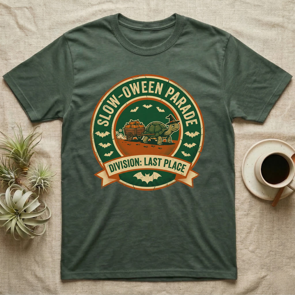 Tortoise Slow-oween Parade T-Shirt in Military Green — Distressed badge of a witch-hatted tortoise pulling a pumpkin wagon, "Slow-oween Parade, Division Last Place."