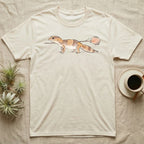 African Fat-Tailed Gecko Watercolour T-Shirt in Natural — Watercolour African fat-tailed gecko in profile beneath a thin twig ending in a soft bloom, drawn with a broken ink line.
