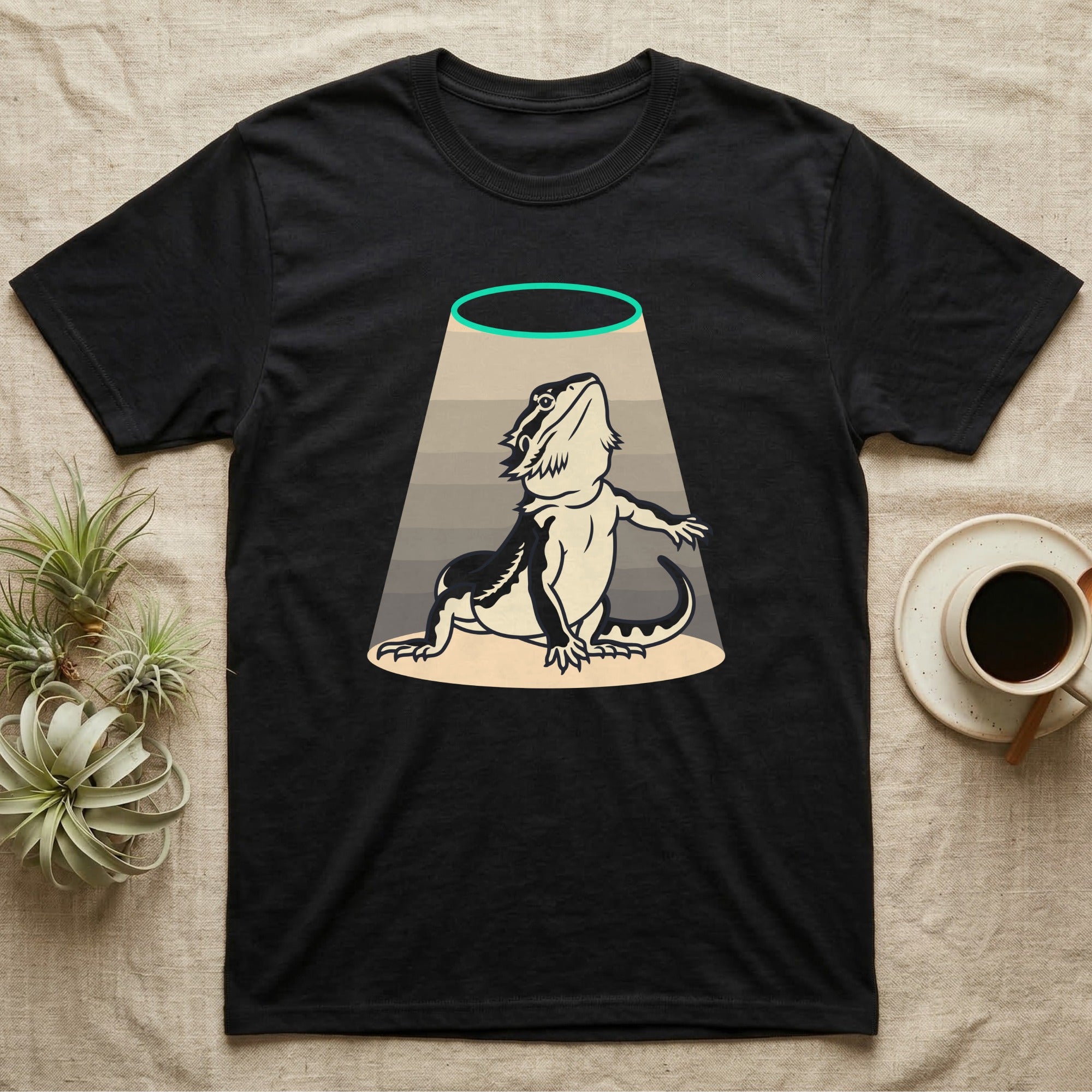 Bearded Dragon Diva T-Shirt in Black — Bold vector illustration of a bearded dragon in a dramatic stage pose under a soft spotlight, chin lifted.