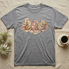 Gecko Book Club T-Shirt in Sport Grey — Warm storybook illustration of three crested geckos in a cozy reading row, each beside a tiny stack of books.