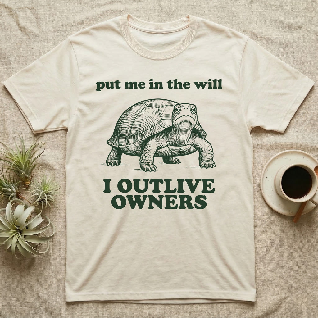 Box Turtle Inheritance T-Shirt in Natural — Engraved eastern box turtle standing head-on between the words put me in the will and I OUTLIVE OWNERS.