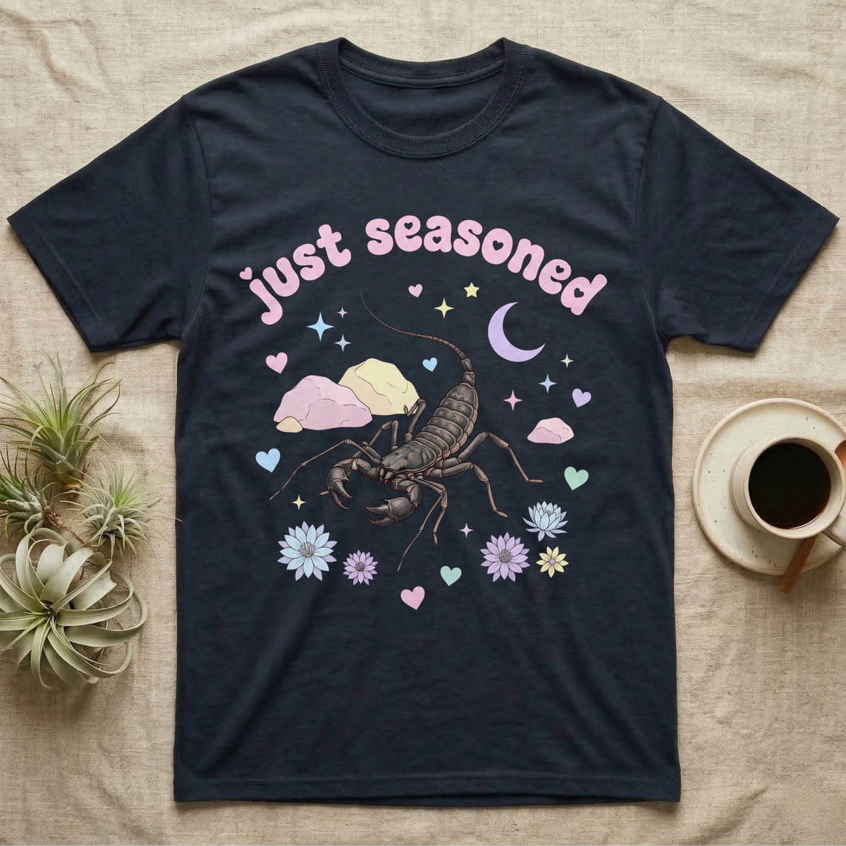 Giant Vinegaroon Baby T-Shirt in Navy — Pastel giant vinegaroon with pincers and whip tail among rocks and a crescent moon, puffy pink wordmark "just seasoned" above.