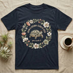 Slow And Steady Graduation T-Shirt in Navy — Watercolour illustration of a tortoise in a graduation cap inside a floral wreath with "Slow & Steady, Class of 2026."