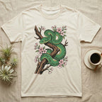 Green snake coiled on a branch with pink cherry blossoms.