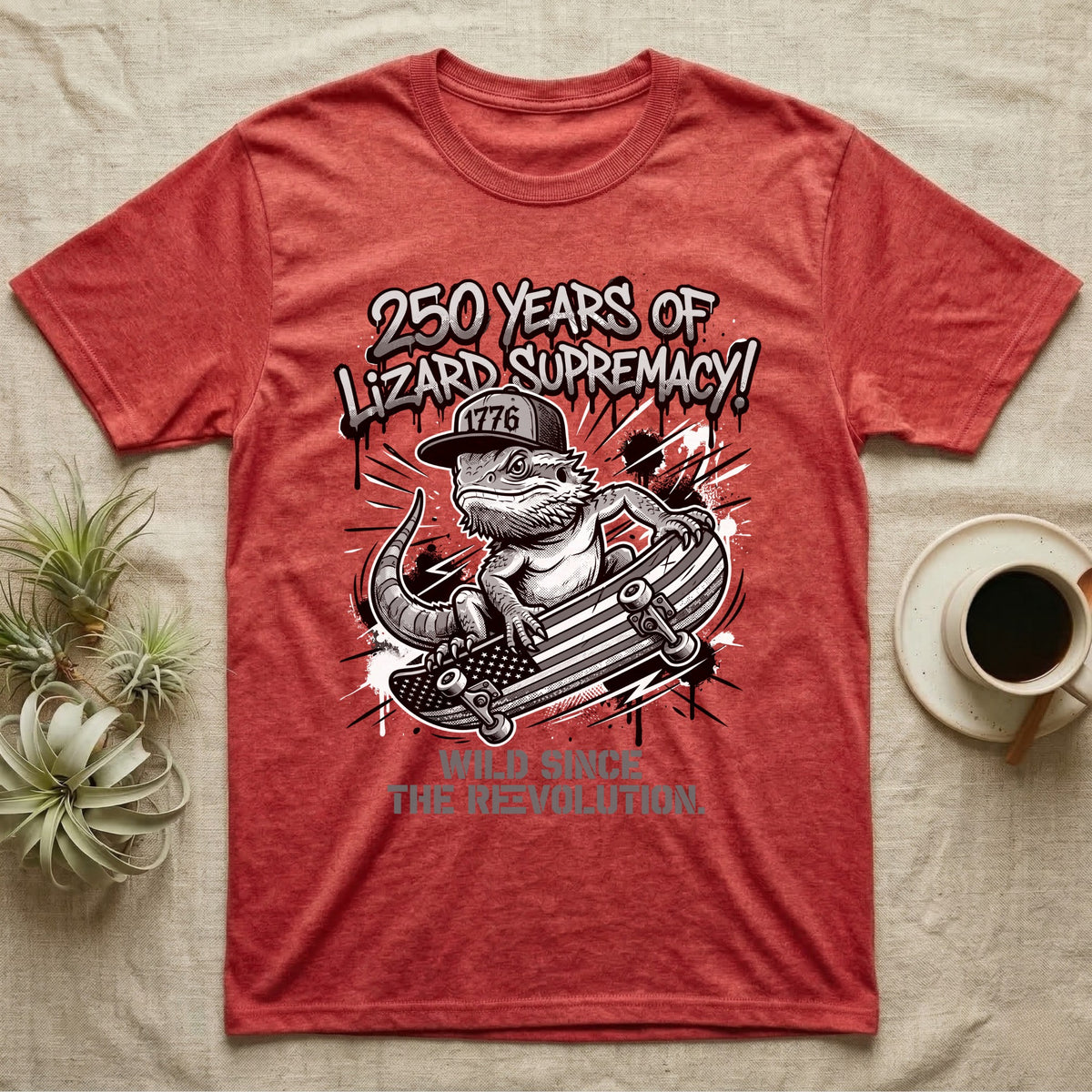 Bearded Dragon Skater T-Shirt in Heather Red — Black-and-white bearded dragon in a 1776 snapback on a flag skateboard under text 250 Years of Lizard Supremacy.