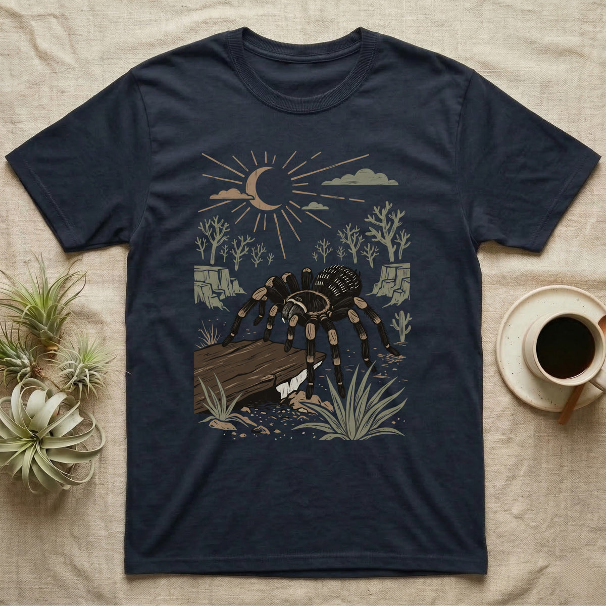 Red-Knee Tarantula Home Range T-Shirt in Navy — Woodcut-style illustration of a Mexican red-knee tarantula at its burrow entrance under a rock slab with desert scrub behind, no on-shirt text.