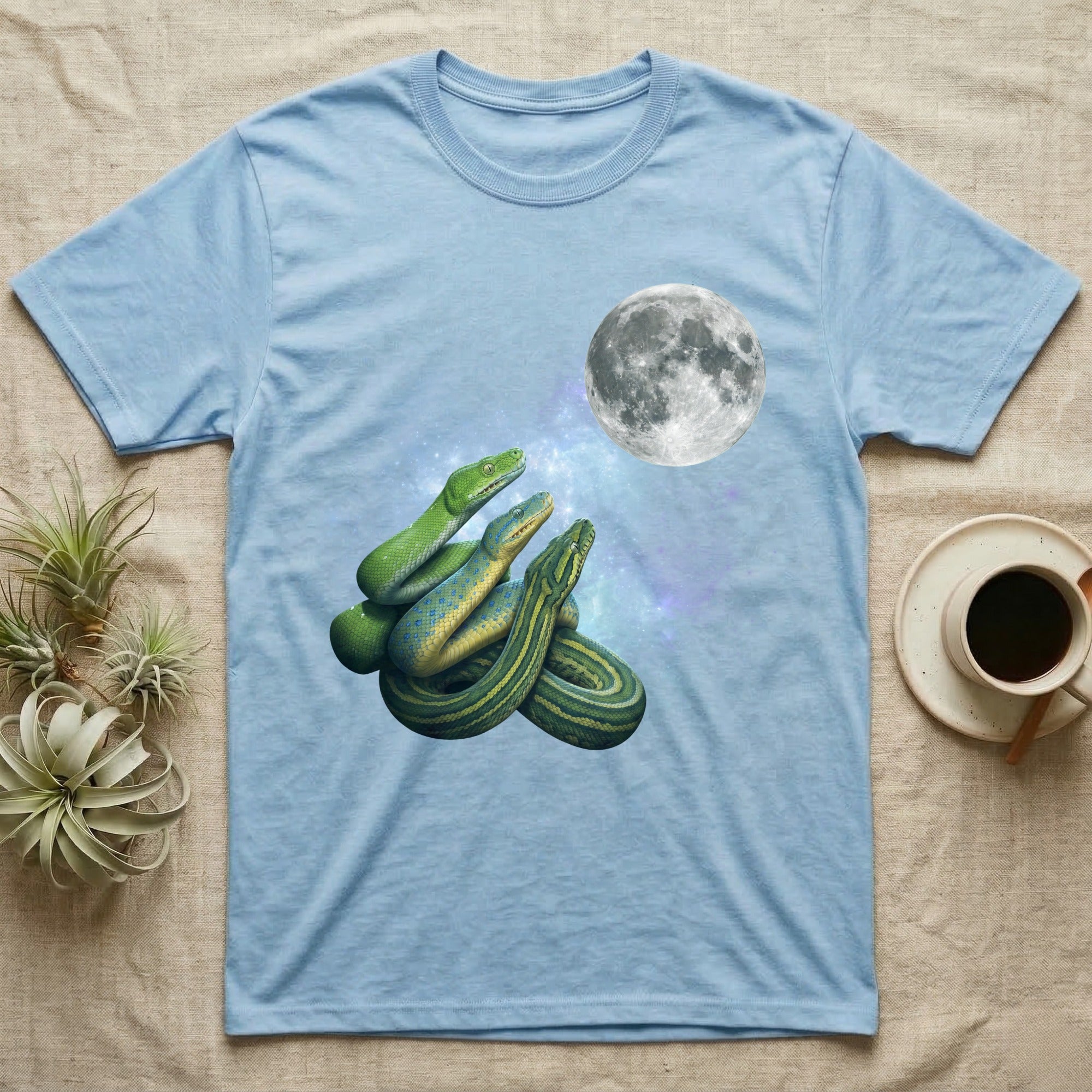 Green Tree Python Moon Howl T-Shirt in Light Blue — Three Green Tree Python colour morphs howling at a full moon over a nebula on a dark grey t-shirt.