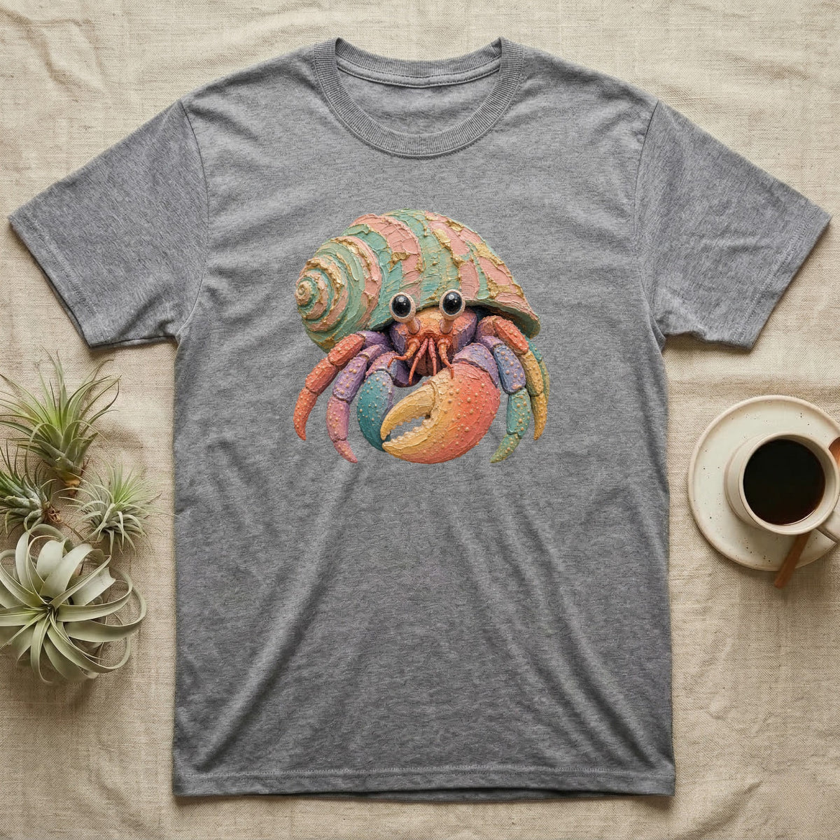 Gray t-shirt with a colorful, cartoon hermit crab design.