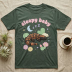 Gila Monster Baby T-Shirt in Military Green — Pastel Gila monster with sleepy eyes, crescent moon and Z Z Z, puffy salmon bubble wordmark "sleepy baby" above.