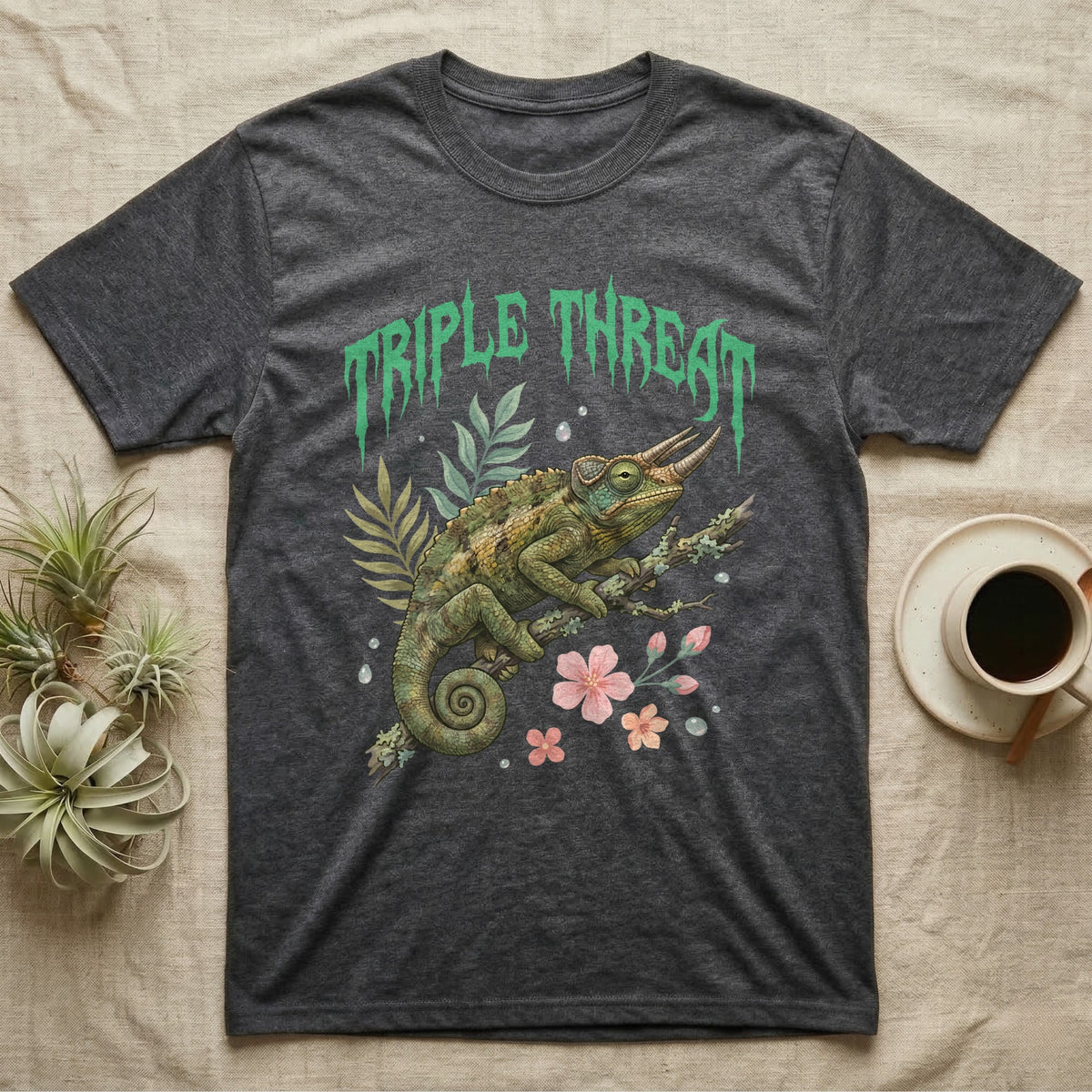 Jackson's Chameleon Feral T-Shirt in Dark Heather — Three-horned Jackson's chameleon on a branch below a dripping jade-green metal "Triple Threat" wordmark