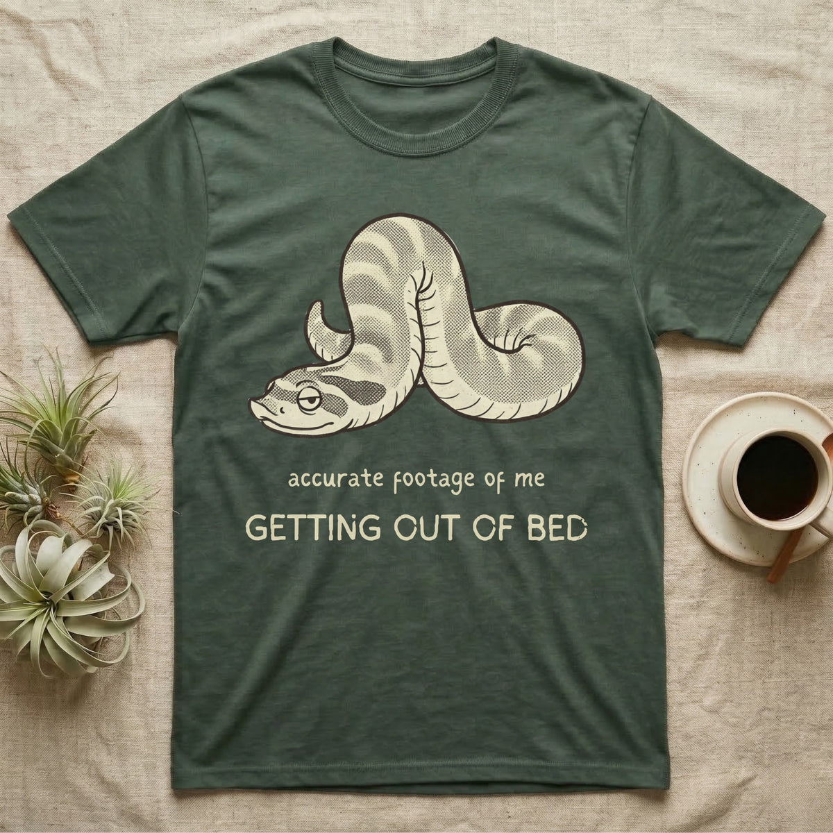 Hognose Morning Mood T-Shirt in Military Green — Retro-illustration of a hognose snake flopped limp with hand-drawn marker text about getting out of bed.