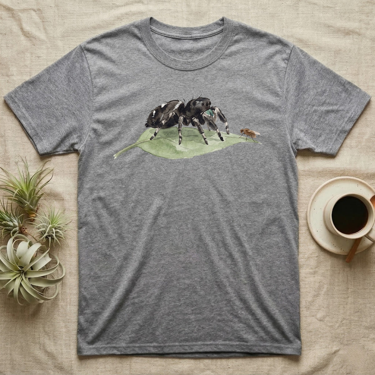 Jumping Spider Watercolour T-Shirt in Sport Grey — Watercolour regal jumping spider standing still on a green leaf, watching a single fruit fly perched on the leaf's tip.