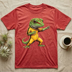 Anthropomorphic giant day gecko in a yellow-and-black martial-arts jumpsuit, low fighting stance, bold vintage-comic ink outlines and halftone shading, graphic-only design. — shown on a Heather Red tee.