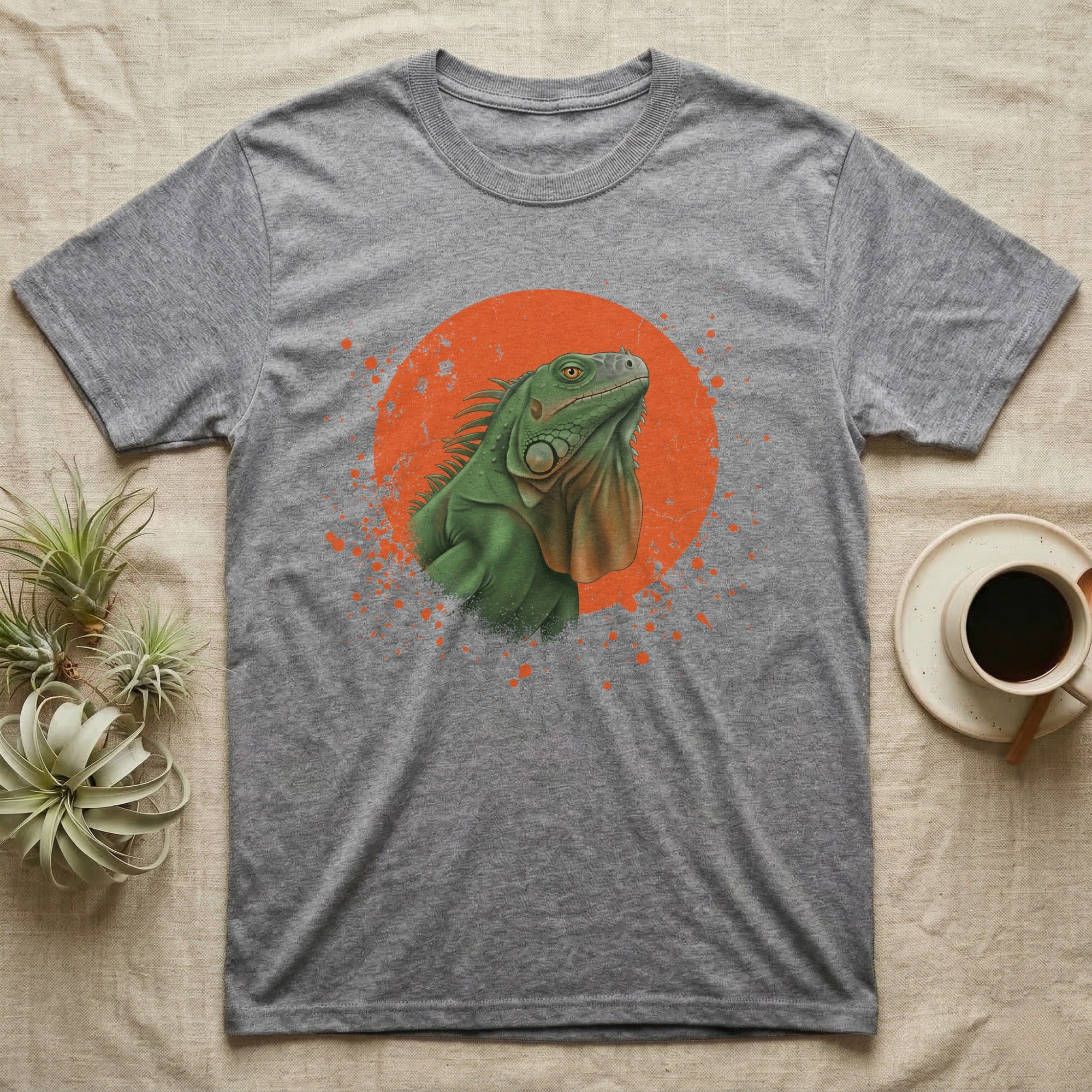 Green Iguana Stink Face T-Shirt in Sport Grey — Distressed vintage-style illustration of a green iguana with its dewlap fully dropped and chin lifted, on an orange disc.