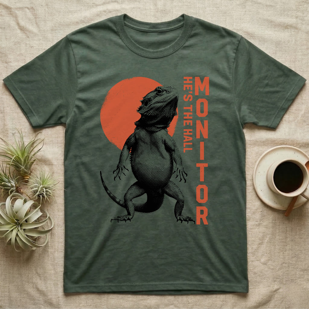 Bearded Dragon Hall Monitor T-Shirt in Military Green — Coarse halftone illustration of a bearded dragon mid-stride, a distressed vermilion disc behind and HALL MONITOR alongside.