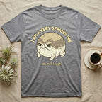 Gray t-shirt with a cartoon toad saying "I am a very serious orb...do not laugh."