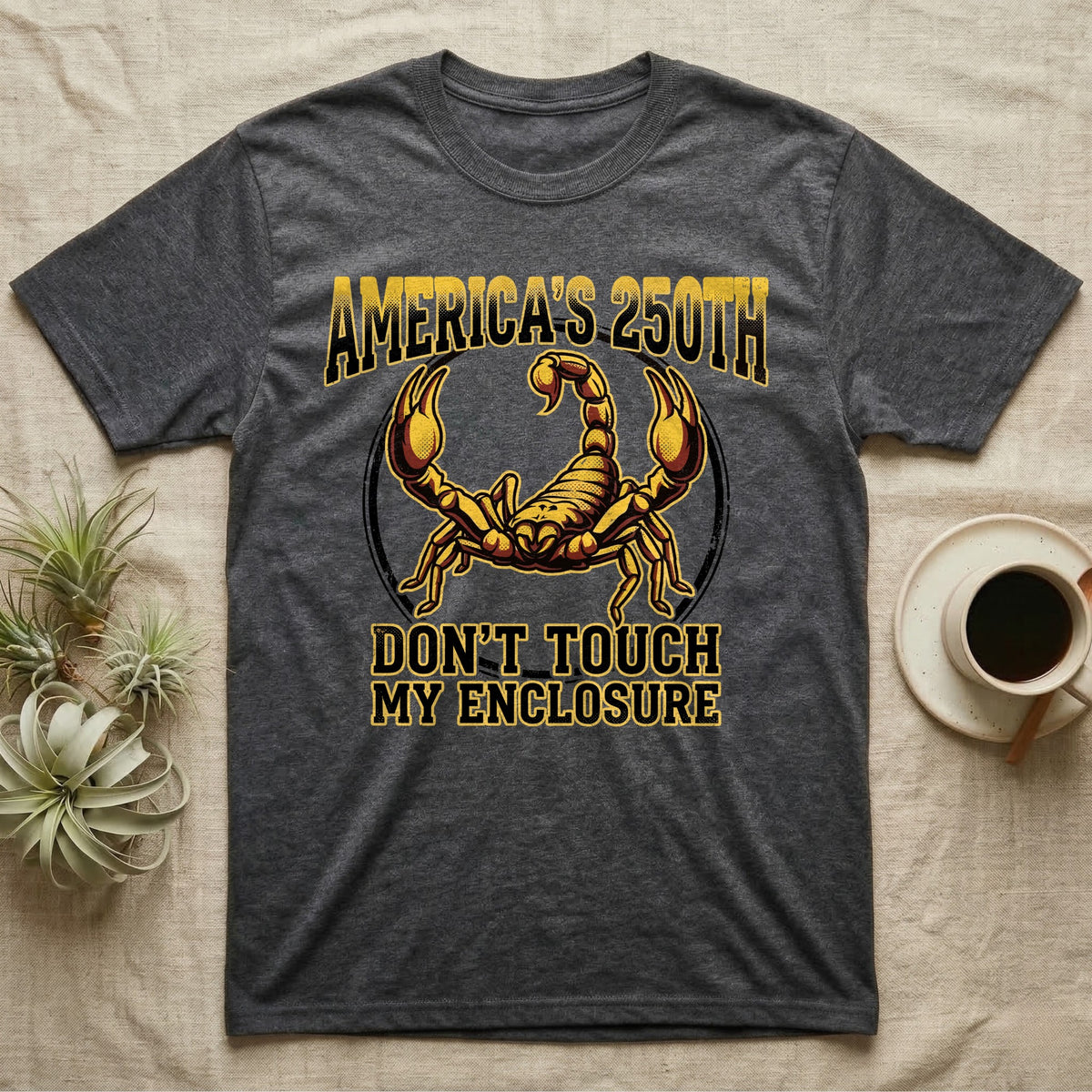 Emperor Scorpion Enclosure Tee in Dark Heather — Bold gold and maroon halftone tee of an emperor scorpion with raised pincers, lettering reading AMERICA'S 250TH Don't Touch My Enclosure on black.