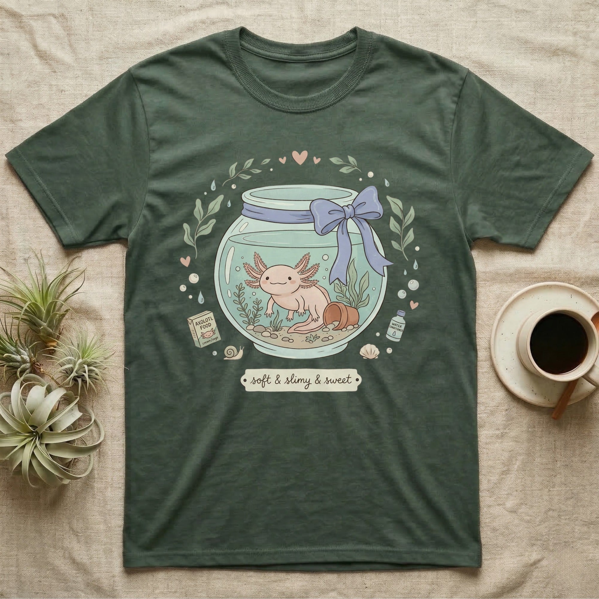 Green t-shirt with axolotl in a jar graphic and text "soft & slimy & sweet".