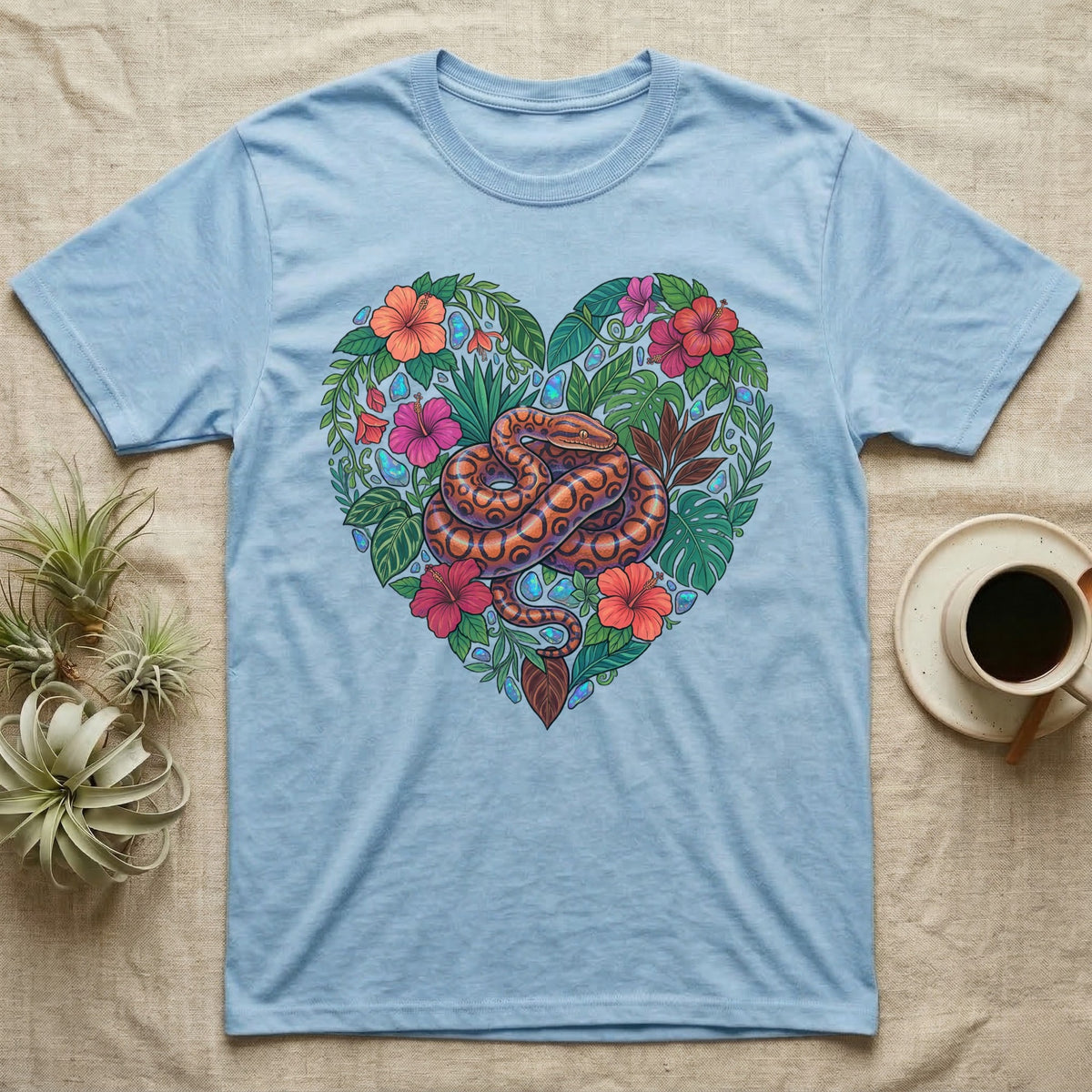 Light blue t-shirt with a colorful snake in a floral heart design.