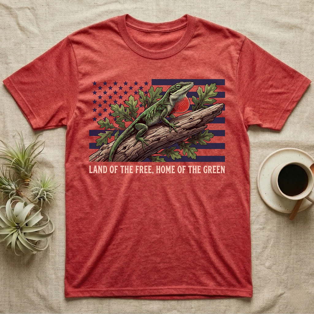 Green Anole 1776 T-Shirt in Heather Red — Realistic green anole with a red dewlap on a branch over a distressed flag under text Land of the Free, Home of the Green.