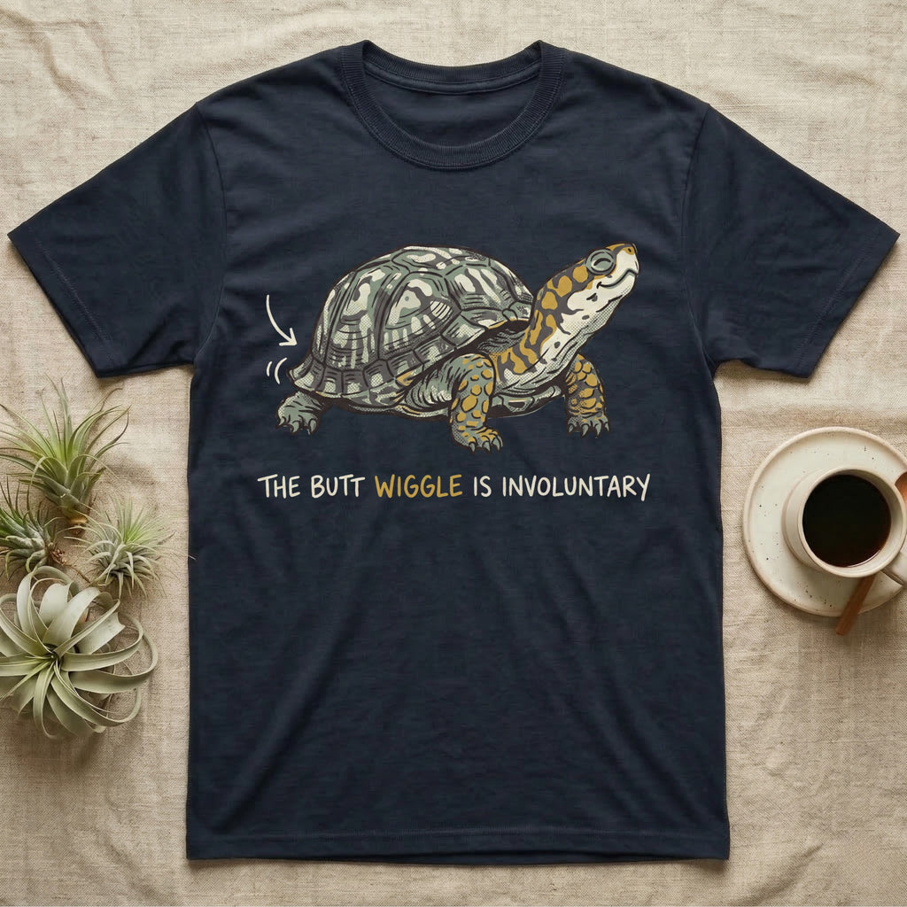 Box Turtle Wiggle T-Shirt in Navy — Retro-illustration of a box turtle mid shell-scratch with a hand-drawn arrow at its wiggling rear and a deadpan marker caption.