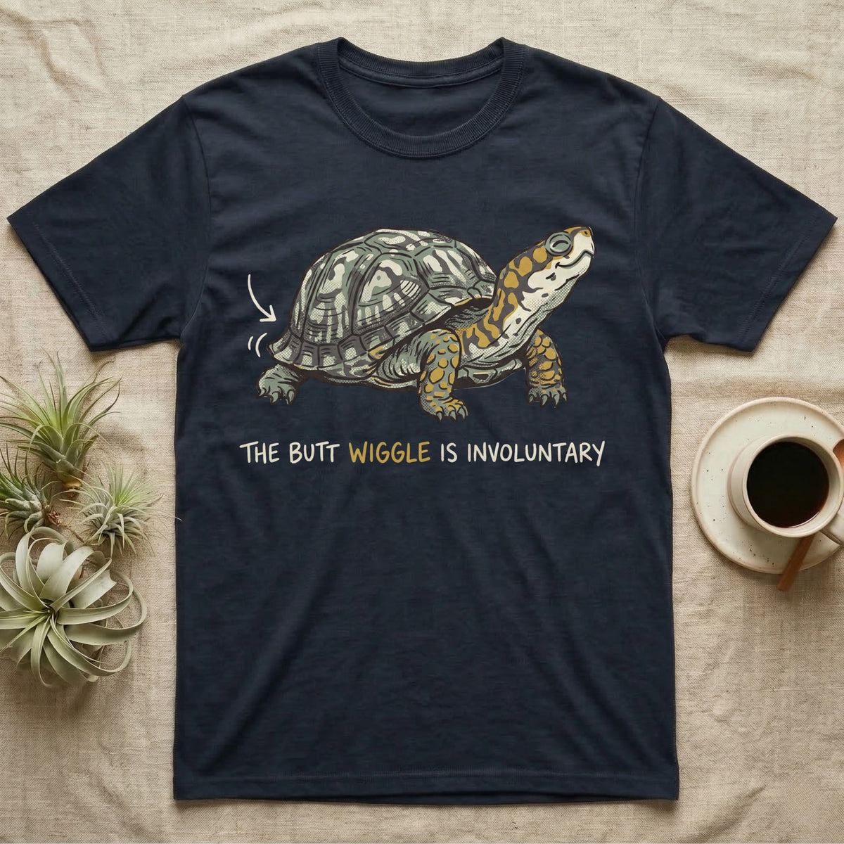 Box Turtle Wiggle T-Shirt in Navy — Retro-illustration of a box turtle mid shell-scratch with a hand-drawn arrow at its wiggling rear and a deadpan marker caption.