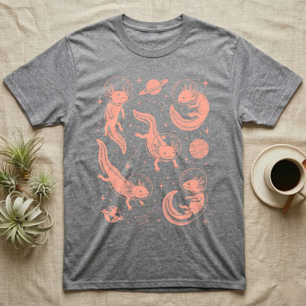 Axolotl Cosmic T-Shirt in Sport Grey — Vintage screen-print illustration of axolotls in astronaut helmets floating in space, soft coral monochromatic on dark background.