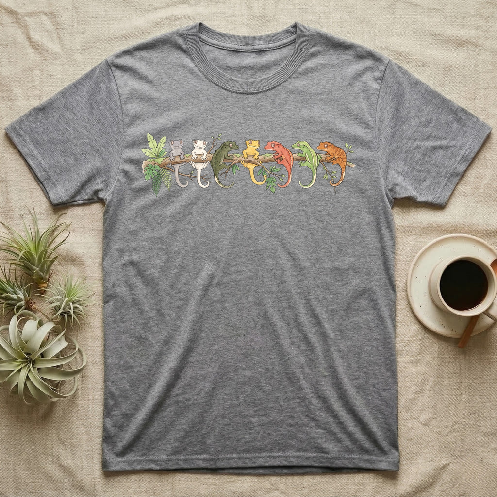 Crested Gecko Canopy Crew T-Shirt in Sport Grey — Watercolor illustration of seven crested gecko colour morphs perched on a branch, dark grey T-shirt design.