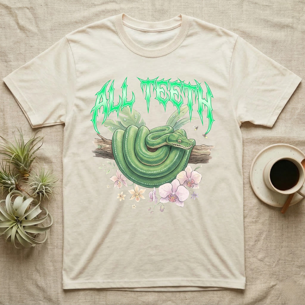 Emerald Tree Boa Feral T-Shirt in Natural — Coiled emerald tree boa on a branch below a dripping emerald-green metal "All Teeth" wordmark