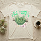 Emerald Tree Boa Feral T-Shirt in Natural — Coiled emerald tree boa on a branch below a dripping emerald-green metal "All Teeth" wordmark