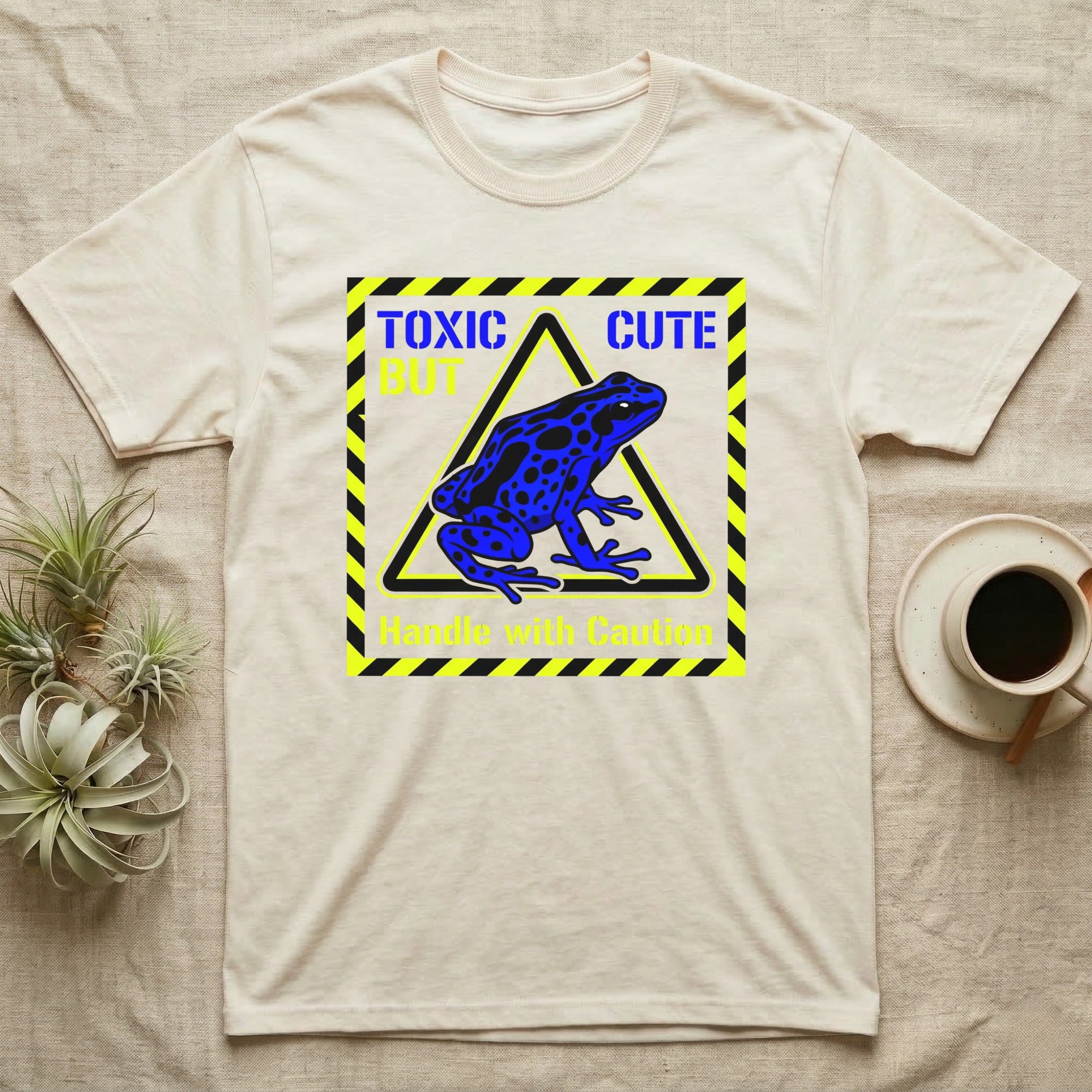 Yellow and black caution sign with a blue frog and "Toxic Cute" text.