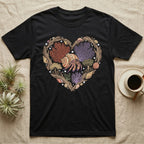 Black t-shirt with a heart-shaped design of shells, coral, and a hermit crab.